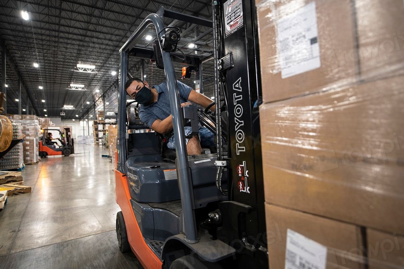 Team members handling parcels at a GoldVault Logistics facility